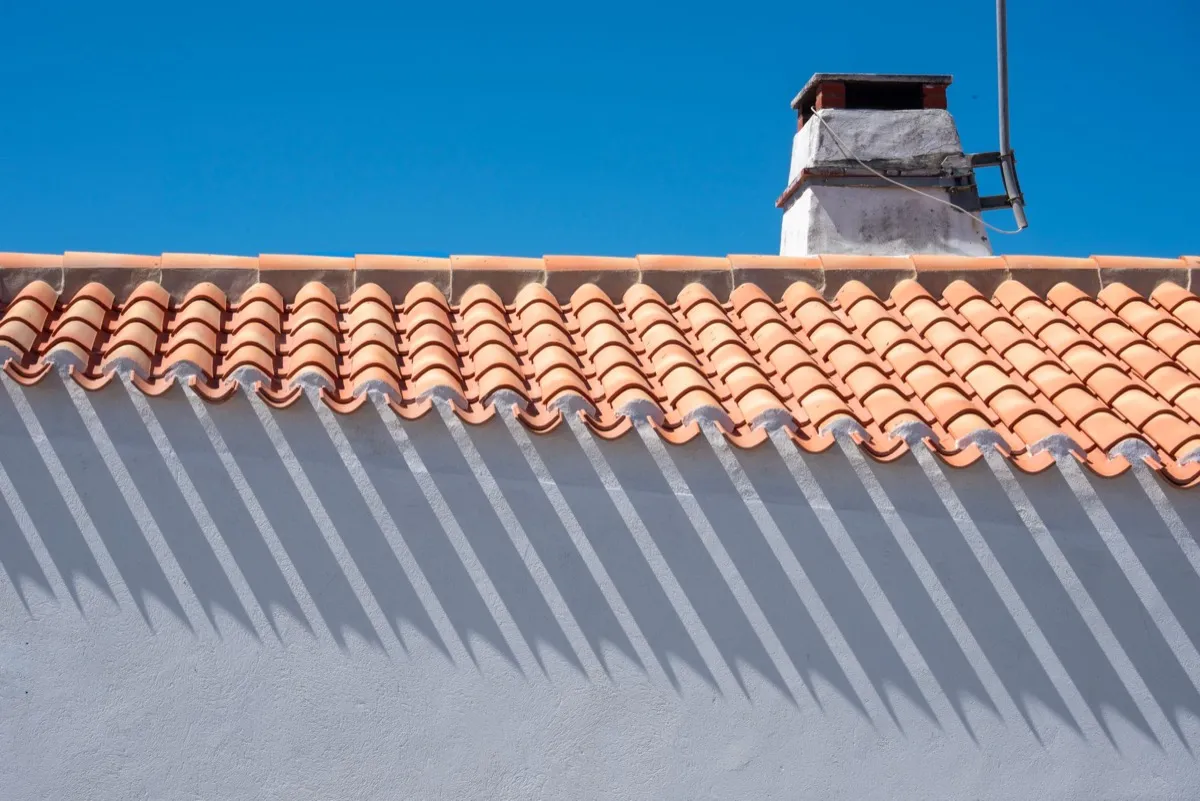 Roof ridge line and chimney on a home in Santa Fe, NM